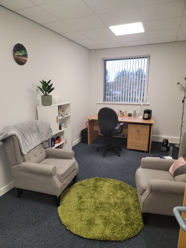The private Younique Therapies counselling room in Consett, with two comfortable armchairs